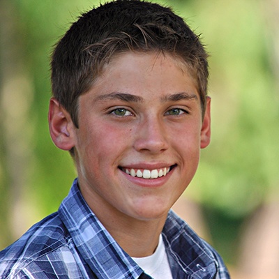 Teen boy with flawless straight teeth