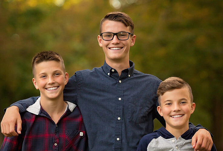 Three young men with straight teeth