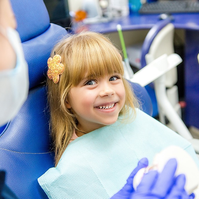 Hyrax Expanders
Child in Heath smiling during orthodontic evaluation
