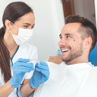 Orthodontist in Heath and patient discussing Invisalign
