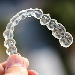 Closeup of Invisalign in heath on colorful background