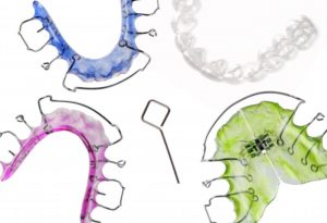 four multiple colored retainers in circle