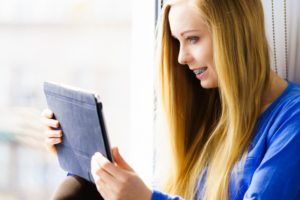 girl with braces reading