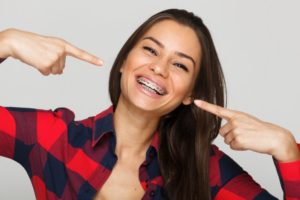 attractive woman smiling with braces