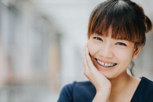 person smiling with braces