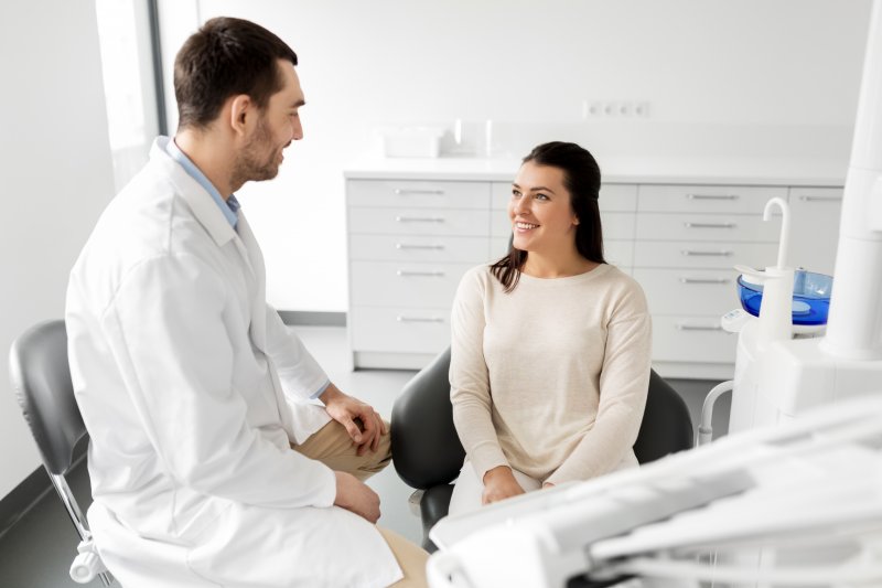 Orthodontist talking to patient at appointment