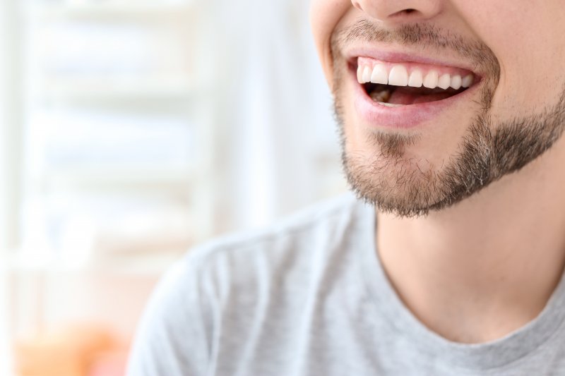 Closeup of man with straight teeth smiling