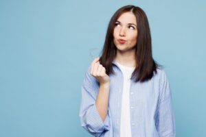 Woman thinking about the other benefits of Invisalign