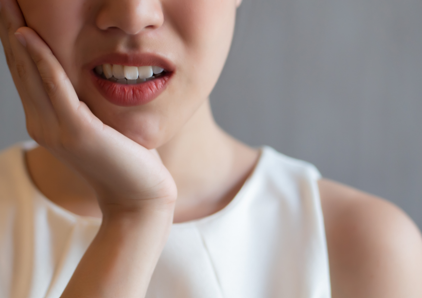 Woman with crooked teeth.
